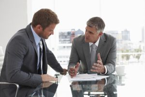 Two men at a meeting